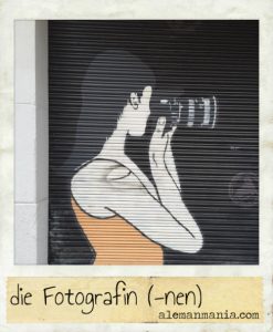 Die Fotografin. Ein Graffiti auf der Straße